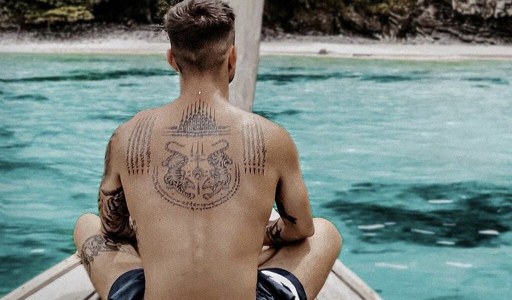 Sak Yant Tattoo | Sak yant tattoo, Red tattoos, Buddhist tattoo